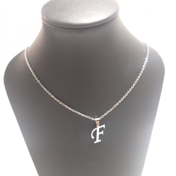 acero quirúrgico 316L.conjunto cadena con inicial.Precio por unidad.