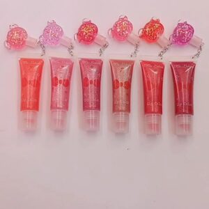 combo de 6 unidades de brillo labial con dijes ( surtidos de colores)