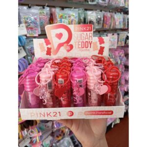 caja completa por 24 unidades de brillo labial frutal más llavero